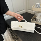 Croc-Embossed Twist-Lock Clutch