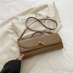 Croc-Embossed Twist-Lock Clutch
